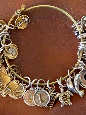 WAXING POETIC BRACELET WITH 30 RARE, COLLECTIBLE CHARMS